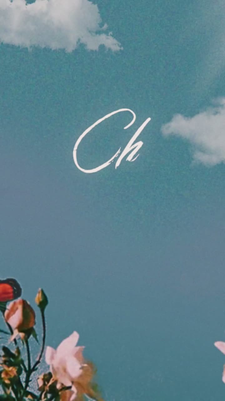 Chez Mila grand opening: a script monogram in a blue sky above flowers.