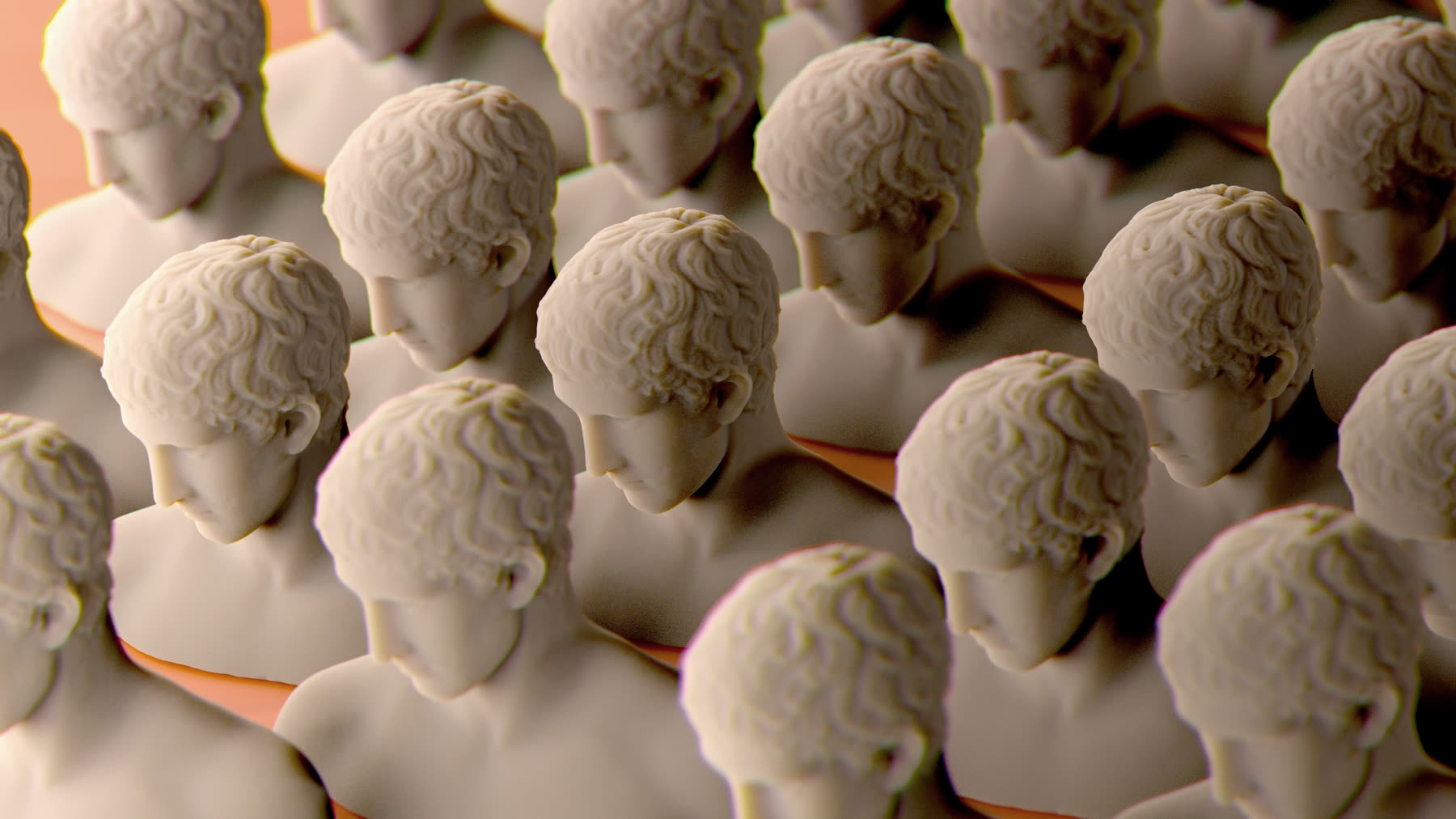 Rows of identical pale plaster busts, lit from above against a warm ground.